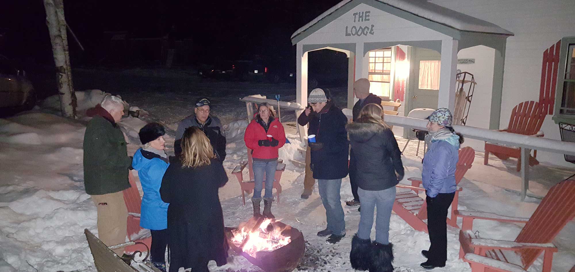 Winter-Celebration-around-a-campfire-at-the-Lodge